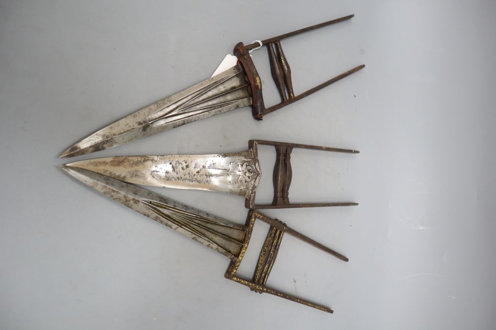 Three Mughal Indian katars in their sheaths